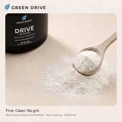 Green Drive creatine boost bottle with scoop of fine white micronized creatine monohydrate powder - unflavored, 5g per serving, no grit